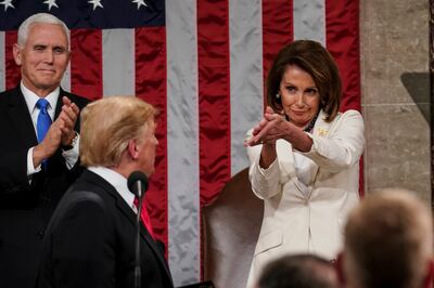 President Donald Trump turns to House Speaker Nancy Pelosi, D-Calif., as he delivers his State of the Union address to a joint session of Congress on Capitol Hill in Washington, D.C., as Vice President Mike Pence watches on Tuesday, Feb. 5, 2019.