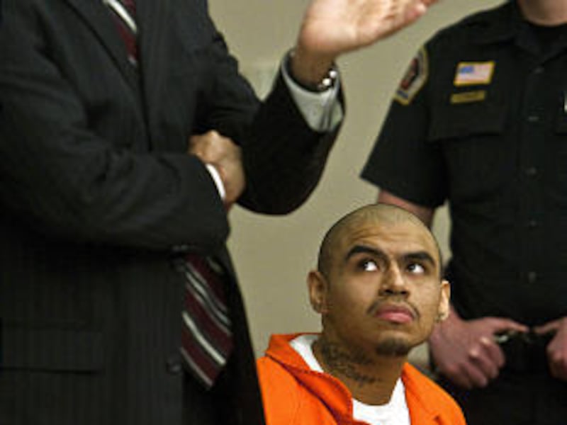 Lesli Castro-Acevedo, left, and 30 other fifth-graders from Jackson Elementary give a violin performance during the awards Friday.