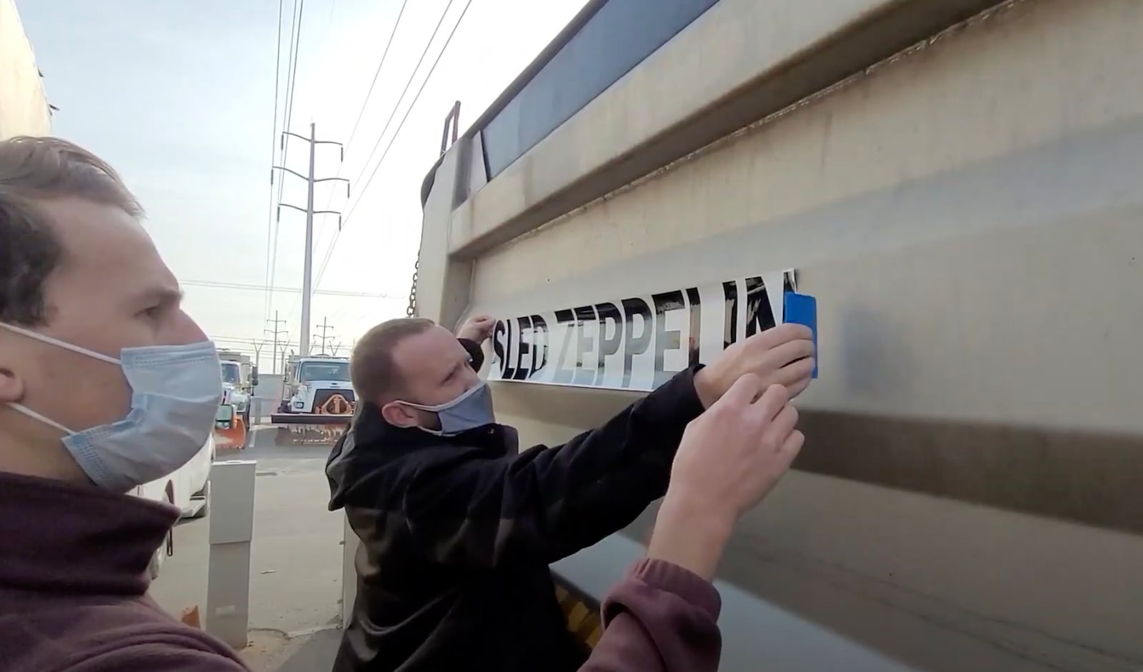 Crews place a sticker naming one of Salt Lake City’s plows “Sled Zeppelin.”