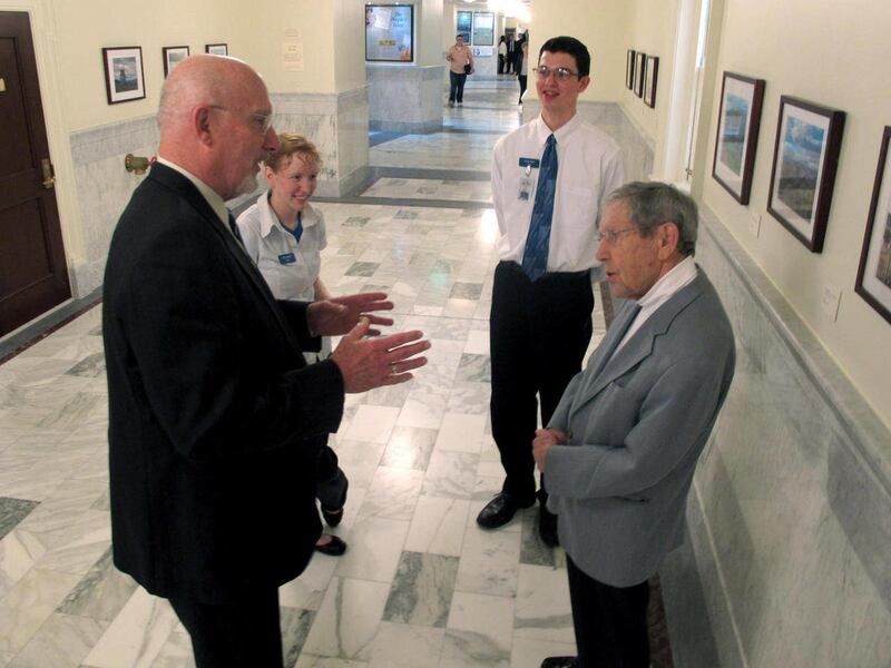 FILE - In this March 6, 2011 file photo, Allen Derr, right, who 70 years ago served in the Idaho House as a legislative page when he was just 13, speaks with the latest class of pages in Boise, Idaho. Derr is being honored for his role as the lawyer for