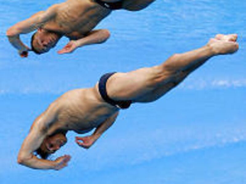 U.S. divers Justin Dumais and Troy Dumais perform in the three-meter synchro springboard event. The brothers earned bronze medals.