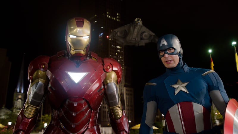 In this film image released by Disney, Iron Man, portrayed by Robert Downey Jr., left, and Captain America, portrayed by Chris Evans, are shown in a scene from "The Avengers."