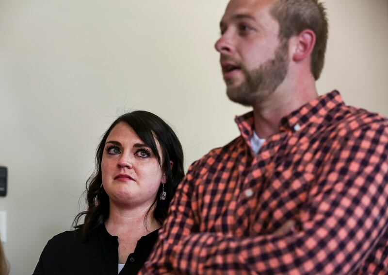 Angela Farrell tears up while her husband, Tyler, gives a thank you speech after receiving the keys to their new home in Layton on Thursday, July 18, 2019. The Farrells' son Lindon was diagnosed with acute kidney failure at 3 months old, prompting the fam