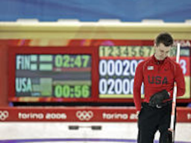 United States skip Pete Fenson looks down after missing an opportunity to beat Finland with the last rock during Monday's Olympic curling match.
