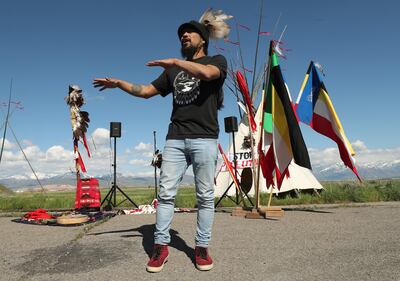Carl Moore, of SLC Air Protectors, sings during a May Day event aimed at fighting the Utah Inland Port project in Salt Lake City on Wednesday, May 1, 2019. The event was sponsored by the Stop the Polluting Port Coalition, which is composed of nonprofits,