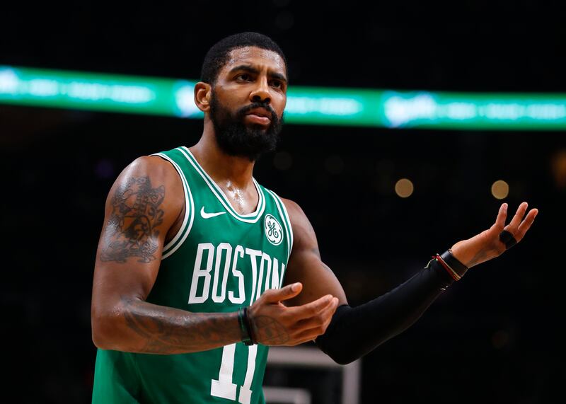 Boston Celtics guard Kyrie Irving (11) reacts to a call in the second half of an NBA basketball game against the Atlanta Hawks, Saturday, Jan. 19, 2019, in Atlanta. (AP Photo/Todd Kirkland)