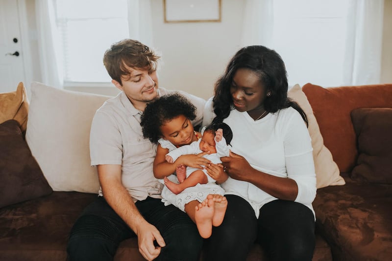 Josephine Bills with her husband, Brady, and her daughters, Zara and Zola.