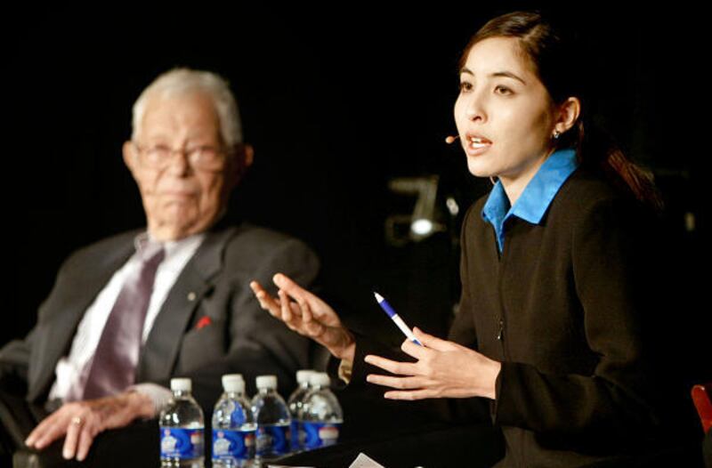 NPR analyst Daniel Schorr, left, watches as Roxana Saberi, an Iranian-American journalist who was imprisoned in Iran, speaks Saturday to a crowd at Rowland Hall in Salt Lake City.