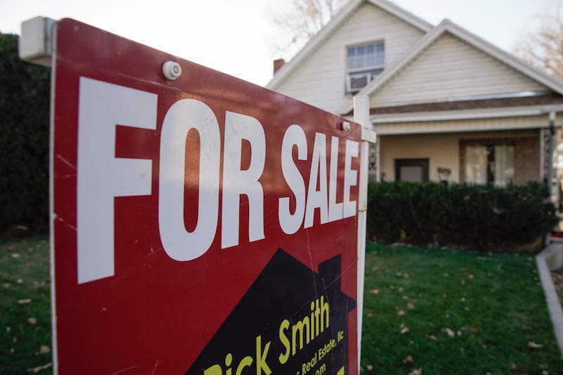 A “for sale” sign is displayed outside of a house in the Sugar House neighborhood of Salt Lake City on Tuesday, Dec. 7, 2021.