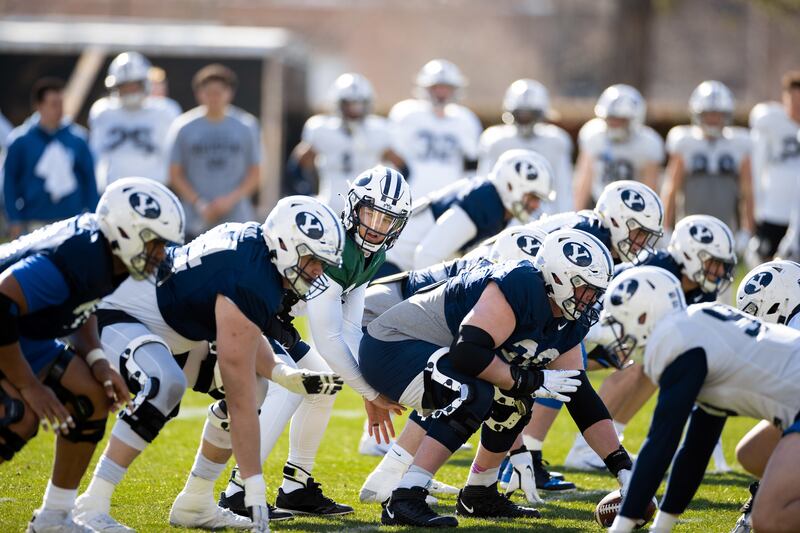 BYU quarterback Jaren Hall prepares to take a snap during 2022 spring camp in Provo.