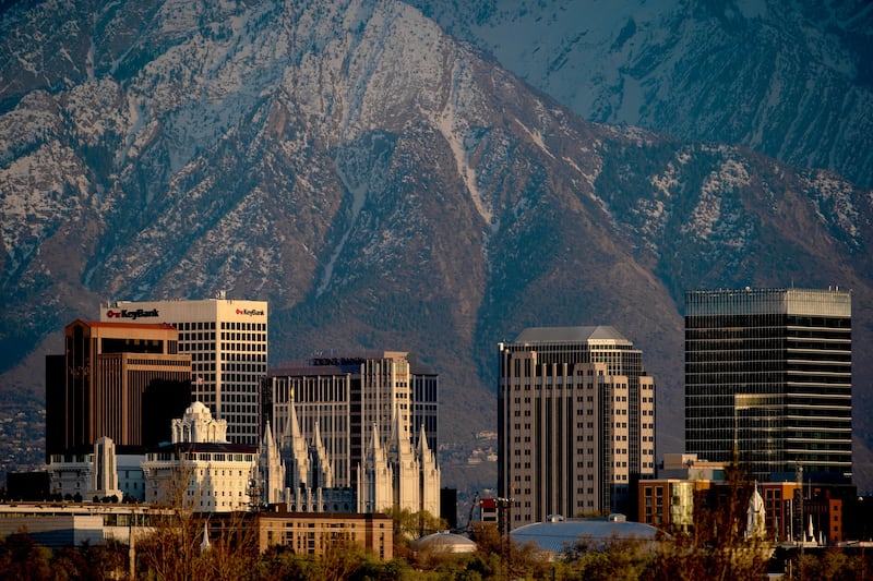 Salt Lake City is pictured at sunset against the backdrop of the Wasatch Mountains on April 17, 2020.