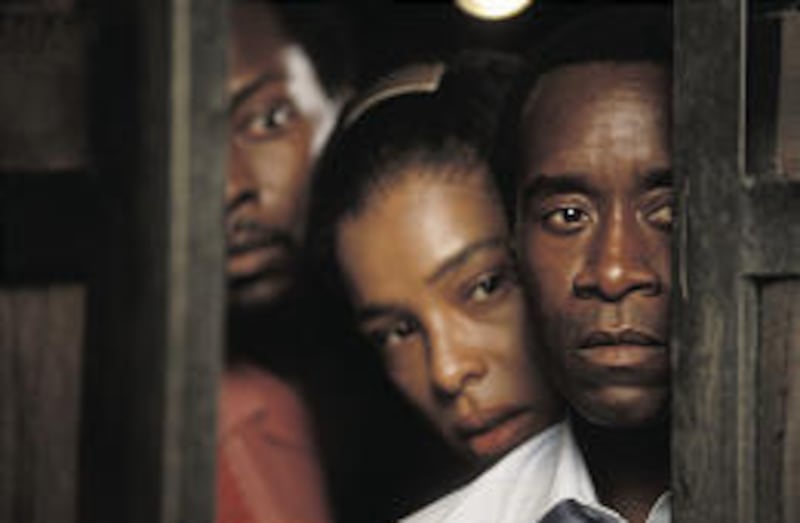 Don Cheadle stars as a hotel manager who saved nearly 1,300 Rwandans during civil war there in the '90s.