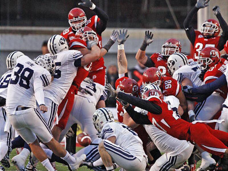 Utah's Brandon Burton (lower right) blocks BYU's Mitch Payne's field goal attempt in the final second as the University of Utah defeats Brigham Young University 17-16 in MWC football Saturday, Nov. 27, 2010, in West jordan, Utah. (Tom Smart, Deseret New