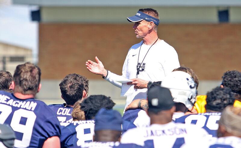 Utah State head football coach Gary Andersen talks to his team at the end of Saturday's scrimmage at Maverik Stadium in Logan.