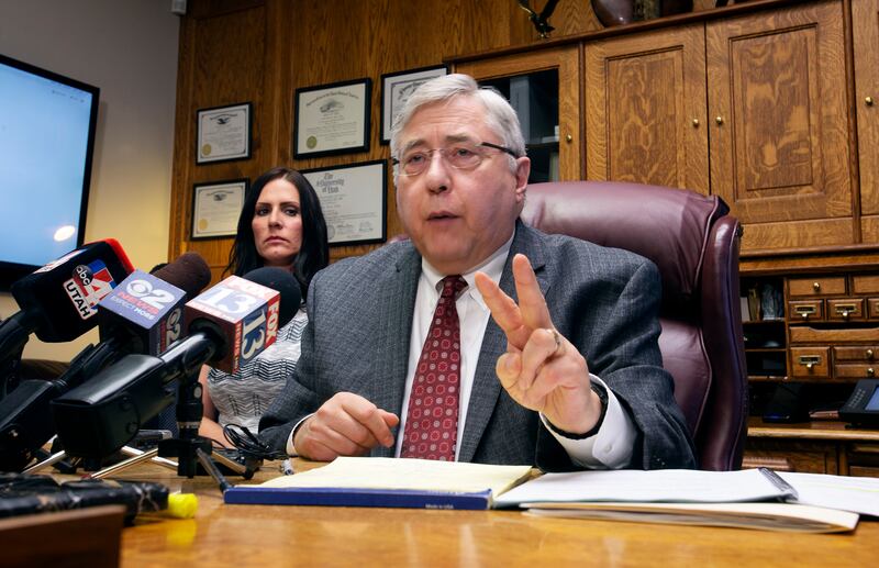 Brenda Mayes, left, listens to her attorney, Robert Sykes, during a press conference in his office in Salt Lake City on Tuesday, May 7, 2019. A civil rights lawsuit in U.S. District Court says a Davis School District bus driver "was driven by racial animu