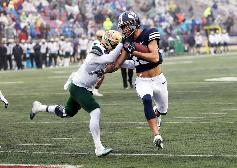 BYU Cougars wide receiver Samson Nacua (45) is hit by UAB Blazers safety Keondre Swoopes (0) as he crosses the goal line for a touchdown as BYU and UAB play in the Radiance Technologies Independence Bowl in Shreveport, Louisiana, on Saturday, Dec. 18, 2021.