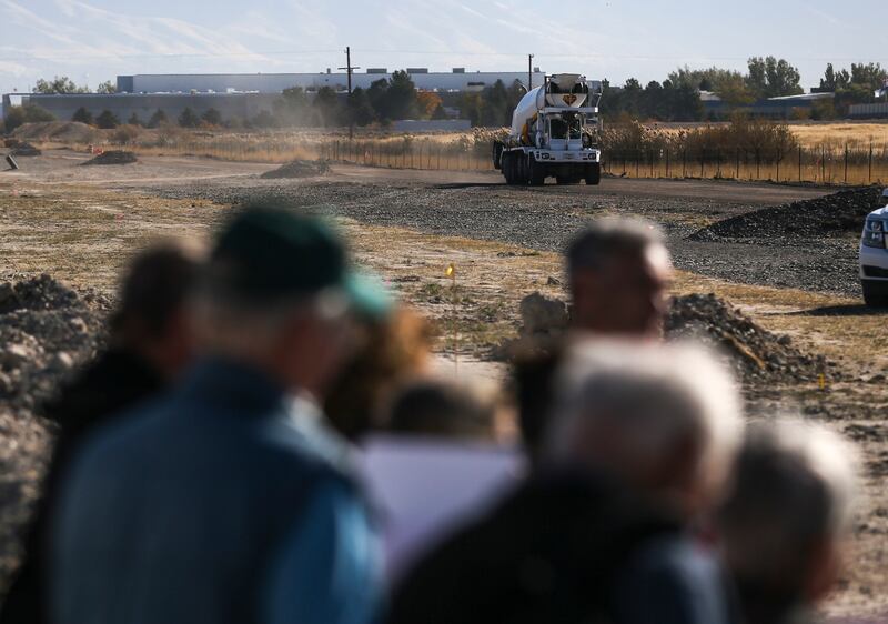A cement truck kicks up dust as it travels to a construction site during a Stop the Polluting Port press conference held west of the Salt Lake City International Airport on Wednesday, Oct. 16, 2019. The group called for the halt of development on about 16,000 acres west of the airport, an area under the jurisdiction of the state-created Utah Inland Port Authority but also near sensitive wetland and migratory bird habitat. 