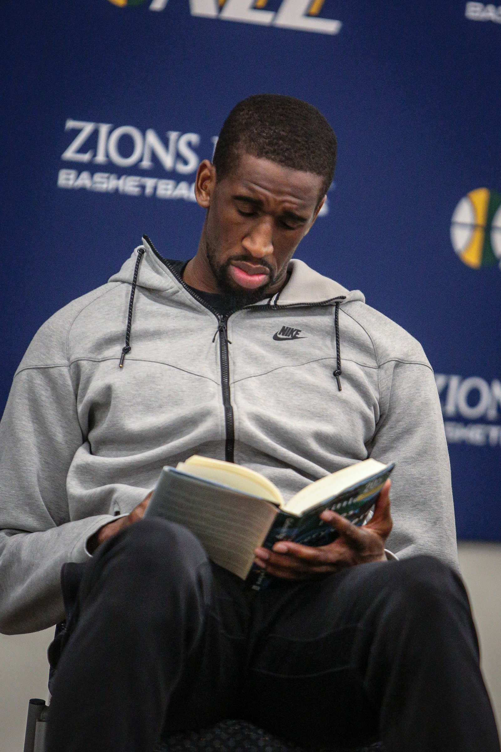 Ekpe Udoh's reads from the book "Little Fires Everywhere" by Celeste Ng during his book club at the Zions Bank Basketball Campus in Salt Lake City on Thursday, Dec. 28, 2017.