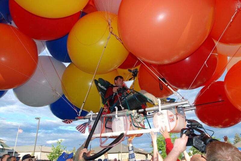 FILE - This July 5, 2008 file photo shows Kent Couch lifting off from his gas station in Bend, Ore., riding a lawn chair rigged with more than 150 giant party balloons for a flight that ended 235 miles away in an Idaho farm field. Oregon's "lawn-chair bal