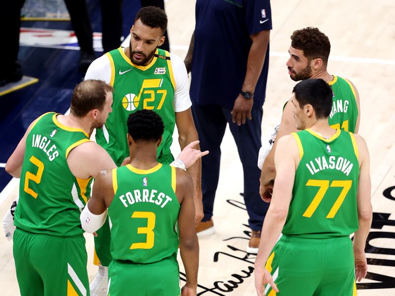 Jazz players talk during a foul review as the Jazz and Nuggets play at Vivint Arena in Salt Lake City on May 7.