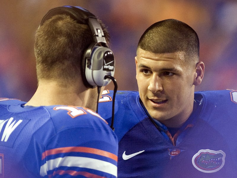 Florida's only tight end ready to play on the team roster, Aaron Hernandez (81), talks with quarterback Tim Tebow (15) on the sidelines during NCAA college football play against Charleston Southern in Gainesville, Florida, Saturday, Sept. 5, 2009. Hernand