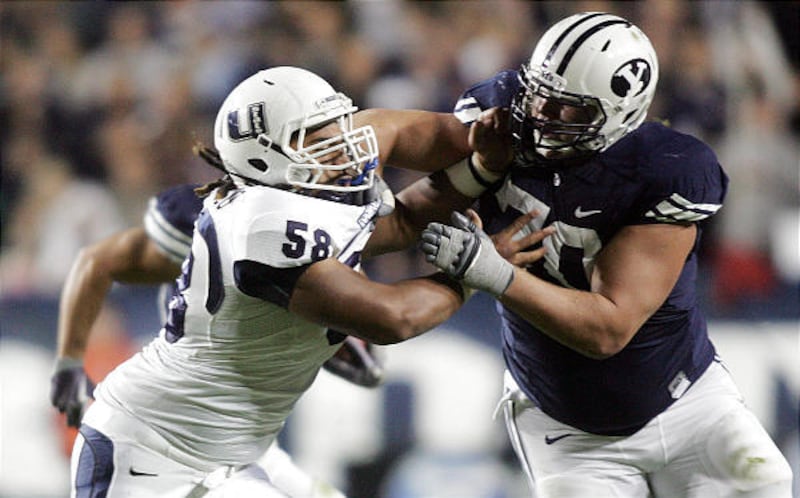 BYU lineman Matt Reynolds, right, says the rivalry is different as a player than it was as a fan of BYU.
