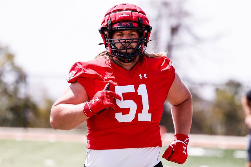 Utah offensive lineman Keaton Bills runs