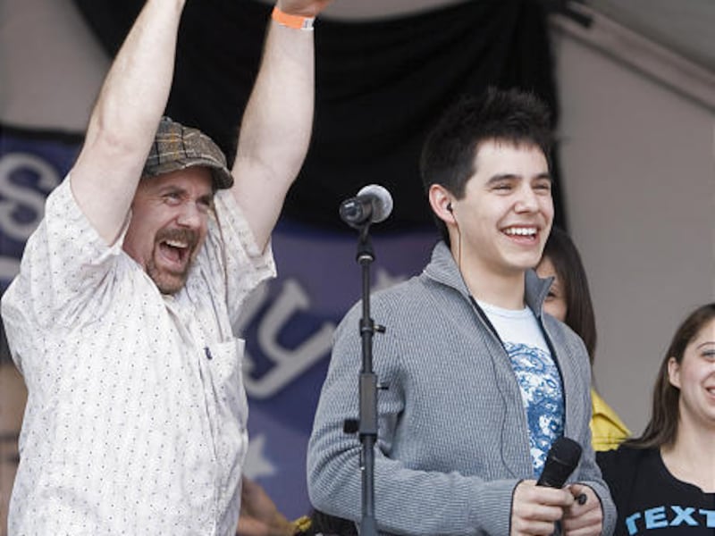 American Idol contestant David Arcuhuleta, and his father, Jeff Archuleta, celebrate before a performance at David's high school Friday, in Murray. Archuleta's father has been banned from rehearsals.