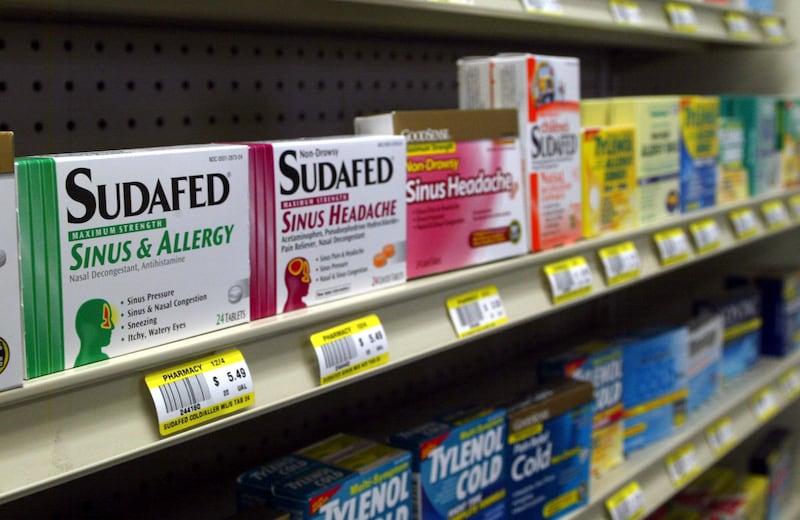 Sudafed and other nasal decongestants on display behind the counter at Hospital Discount Pharmacy in Edmond, Okla.