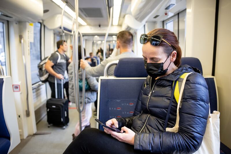 Shandy Wykoff rides a Utah Transit Authority TRAX train.