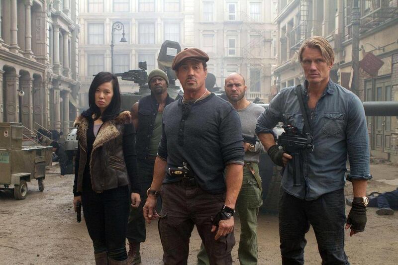 This film image released by Lionsgate shows, from left, Yu Nan, Terry Crews, Sylvester Stallone, Randy Couture and Dolph Lundgren in a scene from "The Expendables 2." The veteran action stars of "The Expendables 2" say a stuntman's on-set death served as