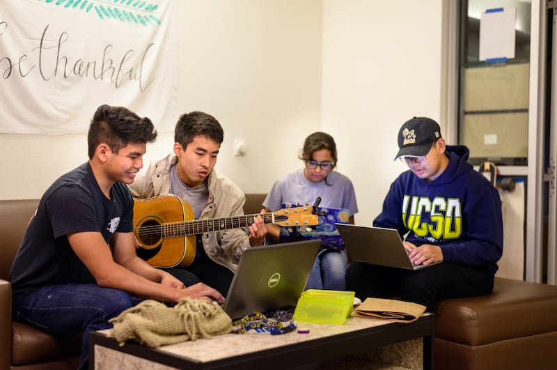Members of InterVarsity Graduate Christian Fellowship at the University of Iowa hang out on campus. The group has filed a lawsuit against the school defending the rights of religious campus organizations.