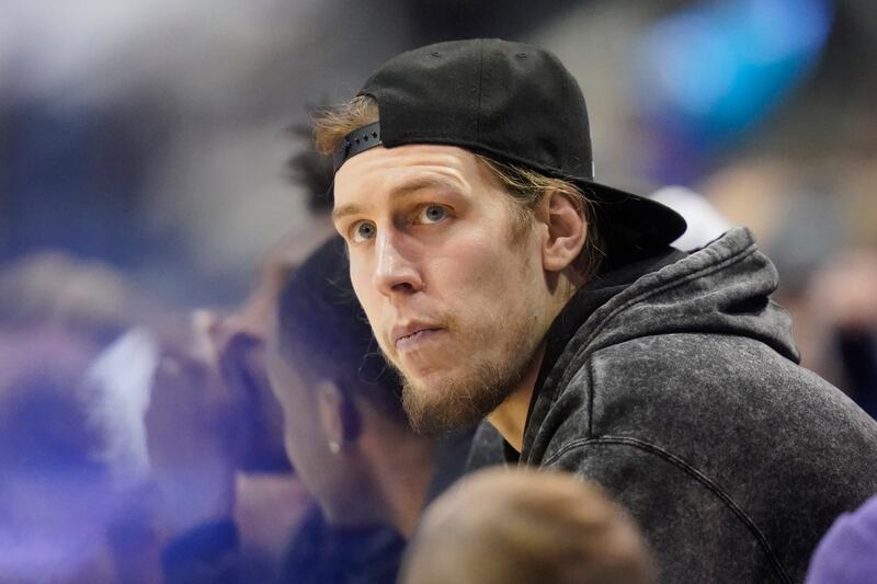 Utah Jazz forward and Gonzaga alumni Kelly Olynyk watches a game between BYU and the Gonzaga during the second half of an NCAA college basketball game.
