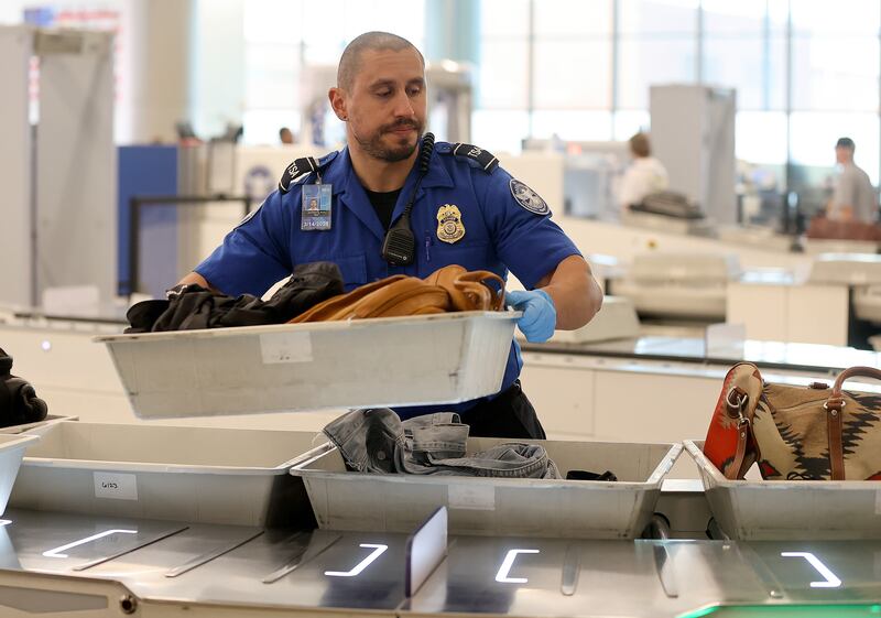 Jeff Ruiz, with the Transportation Security Administration, works at a security checkpoint at the Salt Lake City International Airport on Sept. 19, 2023.