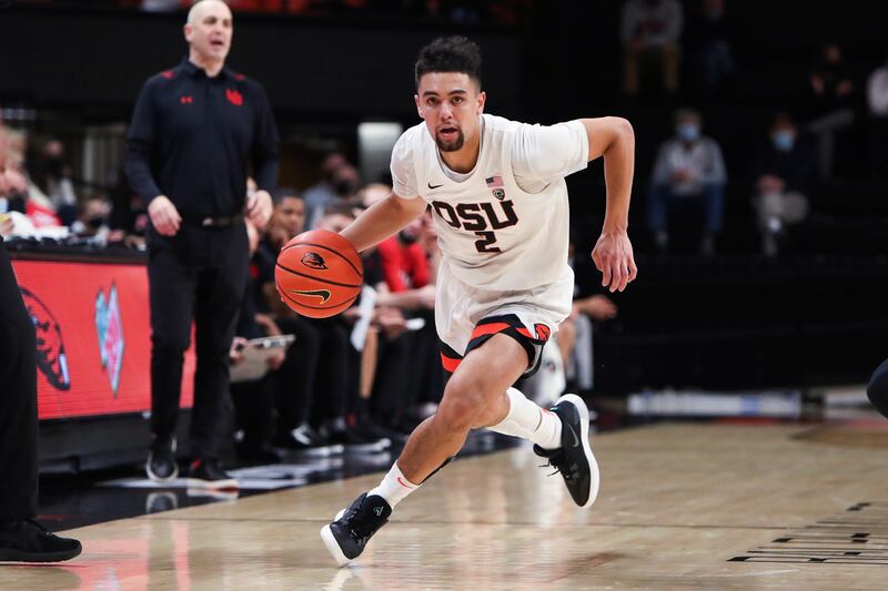 Oregon State’s Jarod Lucas dribbles up the court