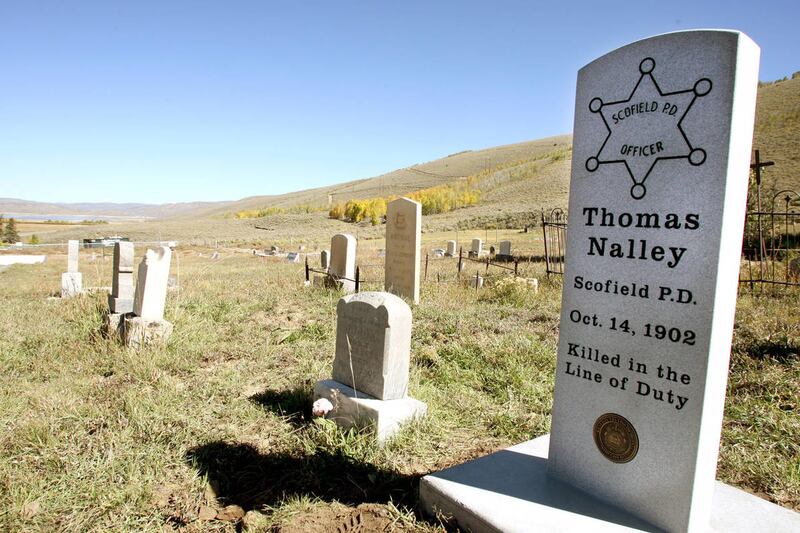 The Utah Law Enforcement Memorial Board unveiled a headstone Tuesday, Oct. 1, 2013, in the Scofield Cemetery to honor Thomas Nalley, who died in October 1902. Nalley, 40, was one of six men deputized by the Scofield town marshal on Oct. 5, 1902. He was pi