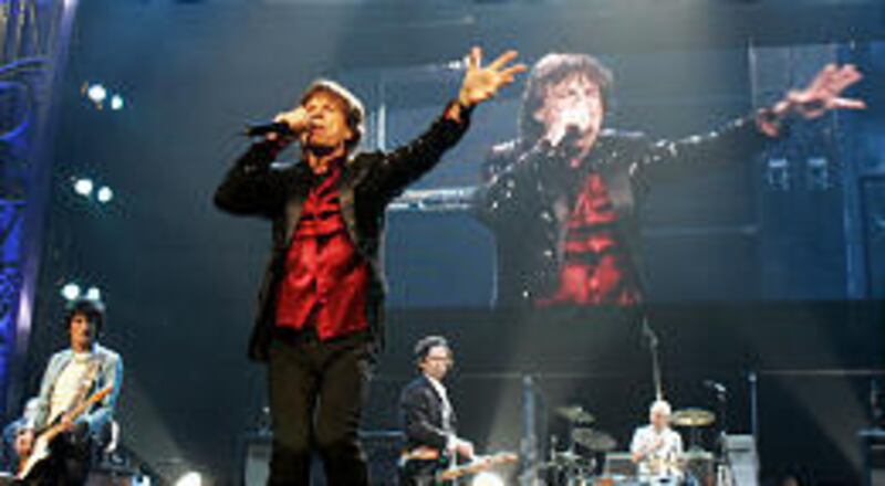 The Rolling Stones' Mick Jagger entertains the sold-out crowd at the Delta Center Tuesday. The band appeared live from Salt Lake City via satellite on the American Music Awards.