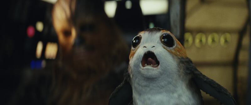Star Wars: The Last Jedi L to R: Chewbacca with a Porg Photo: Lucasfilm Ltd. © 2017 Lucasfilm Ltd. All Rights Reserved.