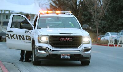BYU police work with parking services at a university basketball game in Provo on Thursday, Feb. 21, 2019.