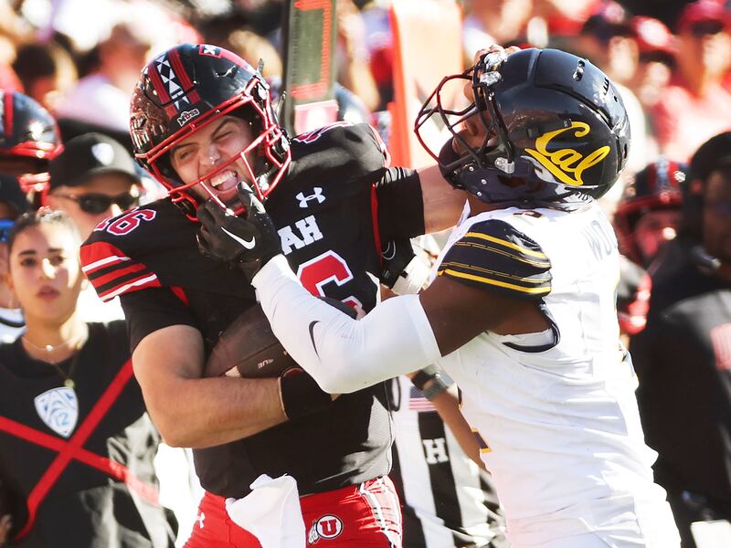 Utah Utes quarterback Bryson Barnes (16) runs for a first down against California Golden Bears defensive back Craig Woodson (2) in Salt Lake City on Saturday, Oct. 14, 2023. Utah won 34-14.