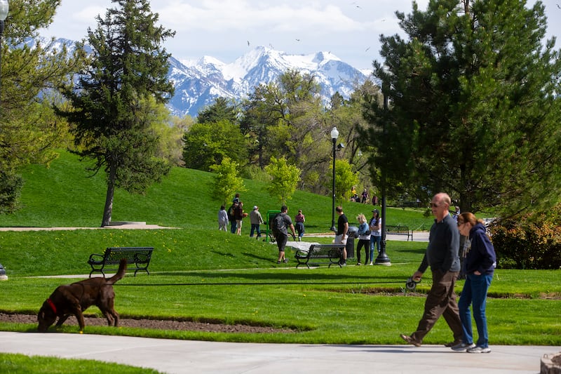 People take in the warm temperatures at Liberty Park on Sunday, April 28, 2019.