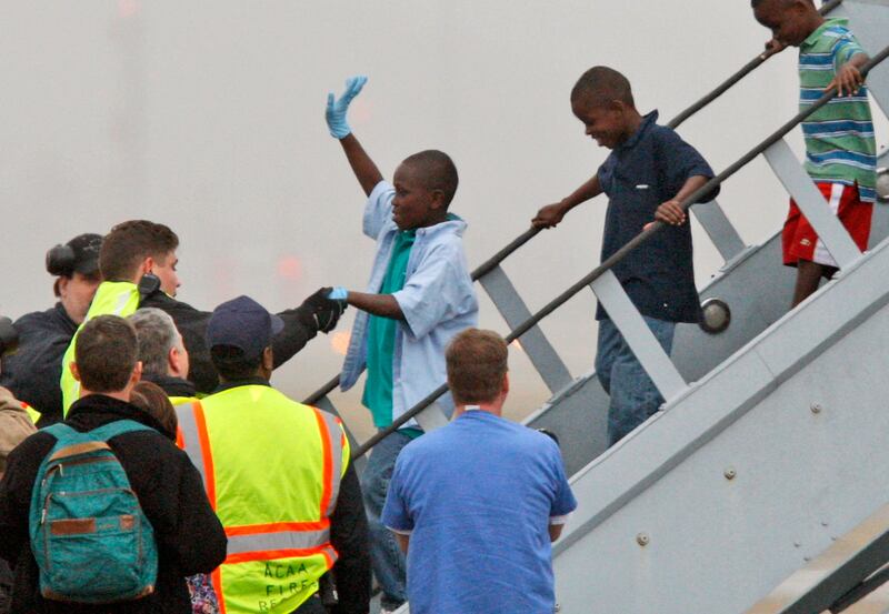 Haitian orphans, whose orphanage was destroyed by an earthquake, are shown arriving in Pittsburgh in 2010.
