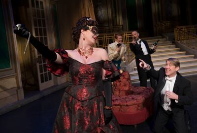 Sara Gartland as Rosalinde, Daniel Belcher as Eisenstein, Abigail Levis as Prince Orlofsky and Troy Cook as Dr. Falke perform in a scene from Utah Opera's upcoming production, "Die Fledermaus," at the Capitol Theatre in Salt Lake City on Wednesday, May 2,