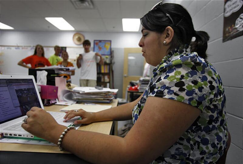 Ariana Leonard, a Wiregrass Ranch High School Spanish teacher, sends text messages to her students during class.