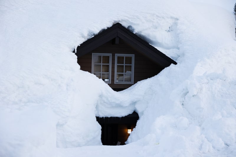 Snow covers a condominium home in Alta.