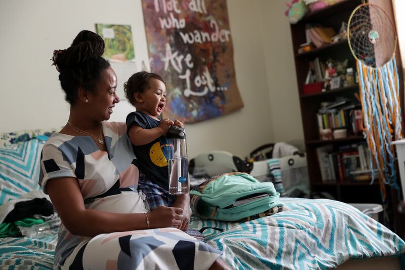 Bianca Bowes, 32, poses for a photo with her 1-year-old son, Neville Weber, at their apartment in Ogden on Tuesday, May 8, 2018.