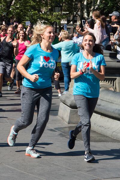 Sarah Williams (left) and April Gould (right), goat yoga instructors from Arizona, make their way to the starting line of New York City's Washington Square Park during the premiere of the 30th season of "The Amazing Race," which airs on Wednesdays on CBS.