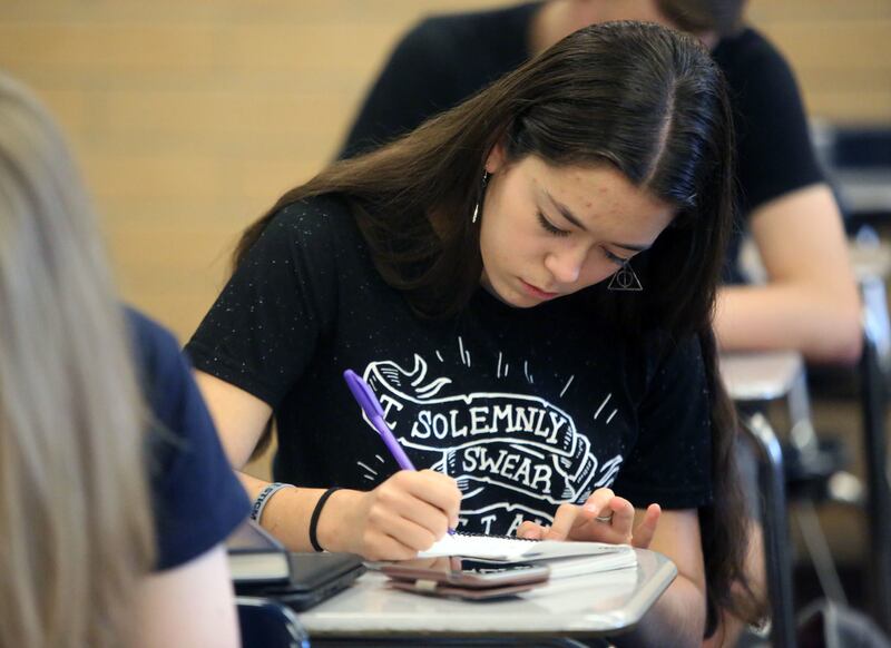 Beca Knapp participates in a Positive in the Present exercise, which includes writing down three things to be grateful for, during first period at Salem Hills High School in Salem on Thursday, May 24, 2018.