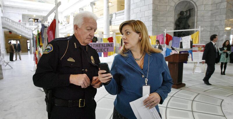 Sandy Police Chief Stephen Chapman and Rep. Jennifer Seelig, D-Salt Lake, speak following a press conference about ending domestic and sexual violence Monday, Feb. 4, 2013.