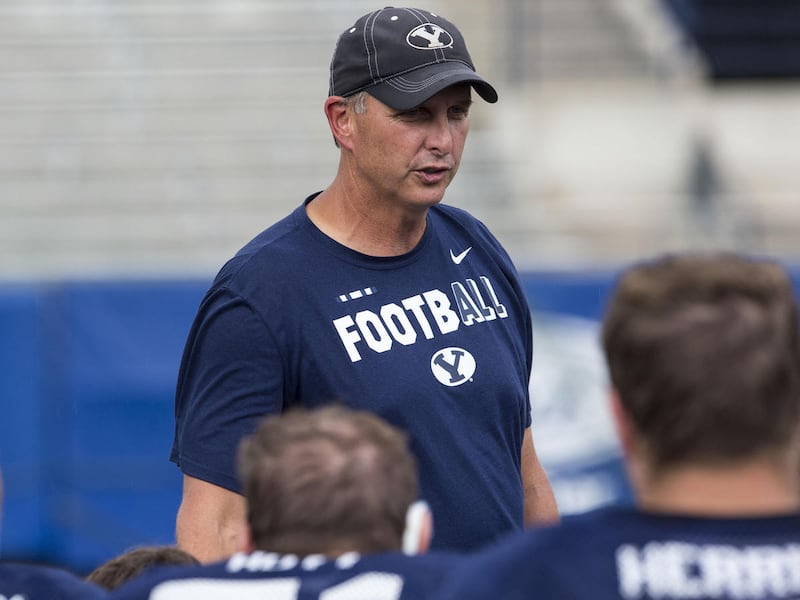 Offensive Coordinator Ty Detmer talks to his players after a BYU football practice in Provo on Thursday, August 10, 2017.